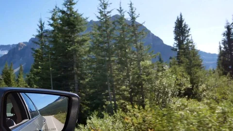 Mirror of the moving car while driving along the local natural way in canada Video stock 120271665