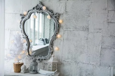 Mirror in an old frame and a white Christmas tree 스톡 사진