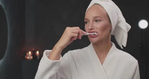 Mirror Reflection Close up of Young Good-looking Woman in White Bathrobe and Stock-Footage 137871973