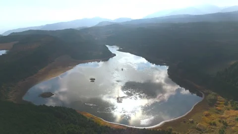 Mirror Reflection of Clouds and Sky on a Lake – 4K Drone Video Stock Footage 336974838