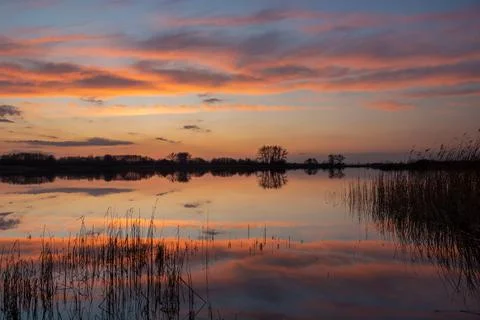 Mirror reflection of clouds in the lake water Stock Photos