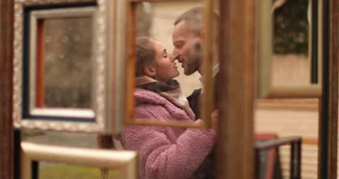 Mirror reflection of a couple in love, tenderly embracing while standing Stock Footage 247184913