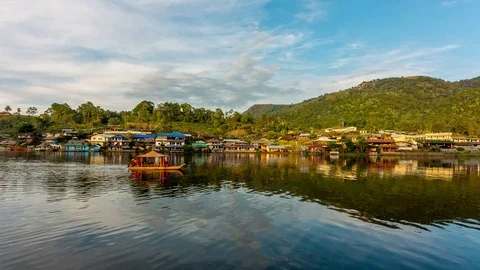 Mirror reflection at evening lake Rak thai village , Thailand Stock Footage 104073738