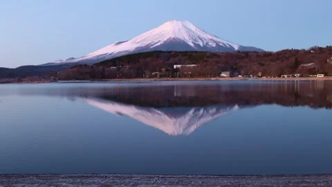 Mirror reflection of Mount Fuji at sunrise at Yamanaka lake, famous tourist Stock Footage 266959924