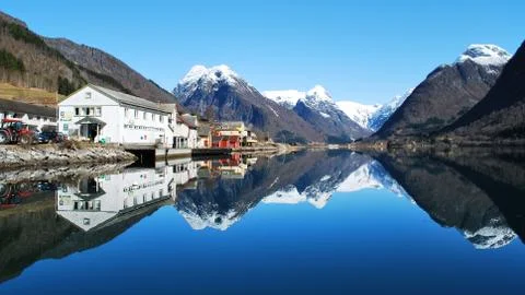 Mirror reflection of the mountains in the lake Stock Photos