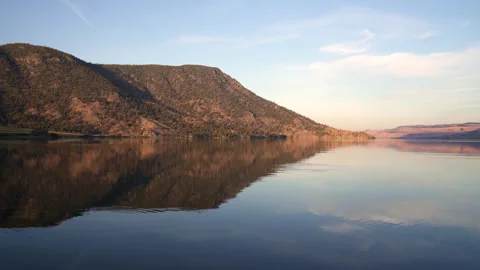 Mirror Reflection Nicola Lake Fish Jumping 4K UHD Stock Footage 337970118