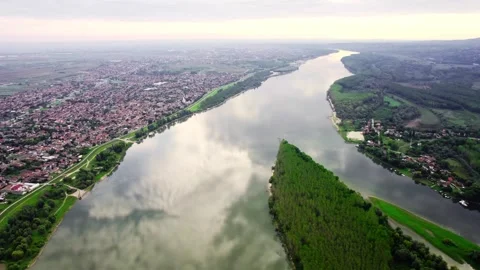 Mirror-like reflection of a sky on surface of a river Danube near town Beocin, Stock Footage 258957770