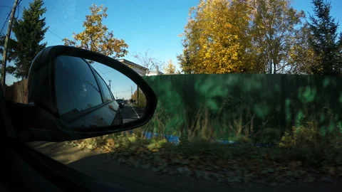 Mirror reflection of the vehicle in the side-view mirror of the car Stock Footage 106672472