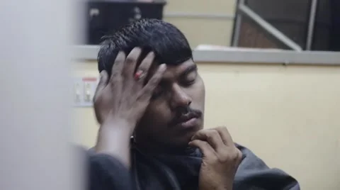 Mirror reflection of young indian man getting haircut Stock Footage 59999429