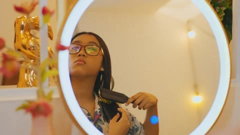 Mirror Reflection of Young Woman Brushing Hair Stock Footage 280910096