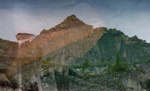 Mirror reflections in Lake Harmony in the high mountains of Ergaki, Russia Stock Photos
