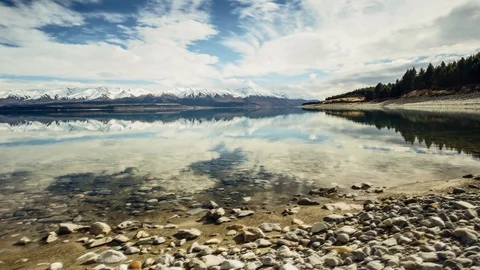 Mirror reflections on NZ lake Stockbeeldmateriaal 96567772