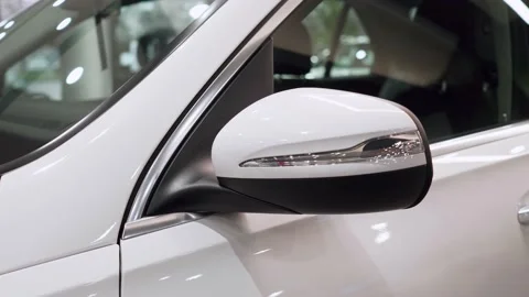Mirror with a rotating lamp of the side door of a premium car close-up. Stock Footage 232754345