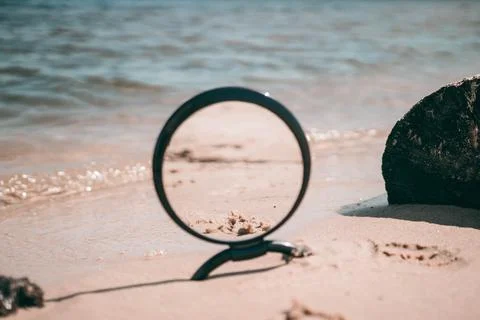 Mirror on a sandy beach Stock Photos