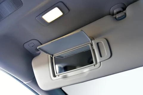 Mirror on the shield to prevent sunlight in the car Stock Photos