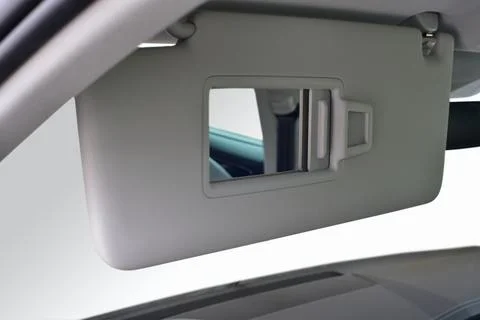 Mirror on the shield to prevent sunlight in the car Stock Photos