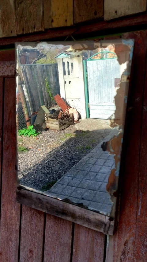 A mirror that is sitting on the side of a building Stock Footage 307590629