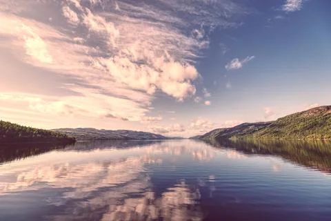 Mirror to the Sky: High-Depth Landscape of Loch Ness Reflecting Clouds 写真素材