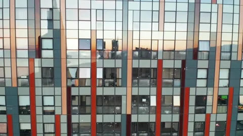 Mirror skyscraper wall background, aerial view. Glass windows of temporary Stock Footage 260222391