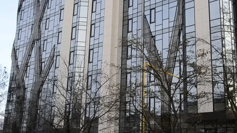 Mirror Skyscraper Wall In Footage With Camera Turn Stock Footage 104166969