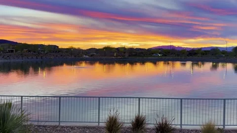 🌅 Mirror Sunset: Crimson &amp;amp; Violet Clouds Reflecting in Lake Stock Footage 330757013