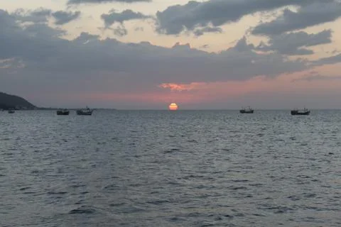 Mirror sunset in the ocean Stock Photos