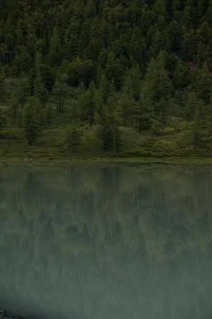 Mirror surface of high mountain lake Akkem Stock Photos