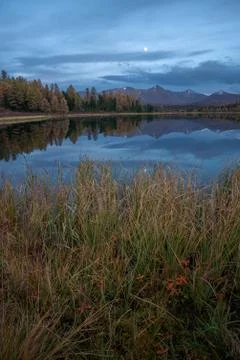 Mirror Surface Lake Autumn Vertically Orientated Landscape With Mountain Range Stock Photos