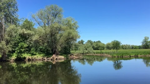 The mirror-like surface of a quiet forest lake. Video stock 109435219