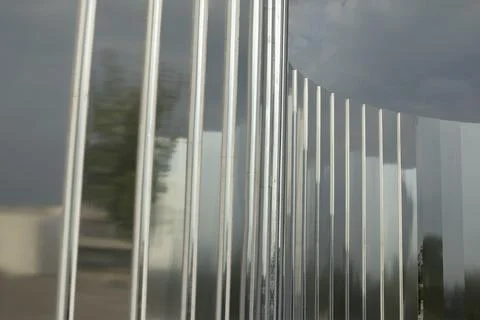Mirror wall in the park. Architectural element to decorate the city. Reflecti Stock Photos