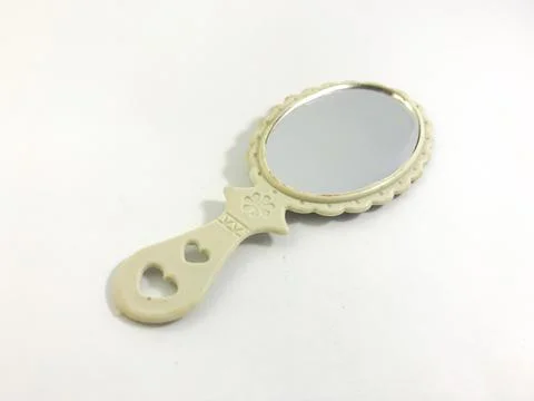 Mirror with white handle Stock Photos