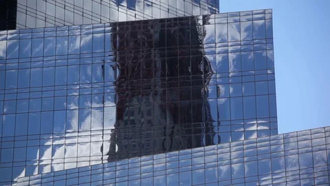 Mirrored Building Reflects Clouds Stock Footage 77110821