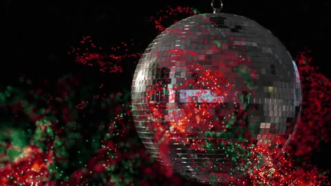 Mirrored disco ball rotating in dark studio void, glowing red and green Vidéo 308069259
