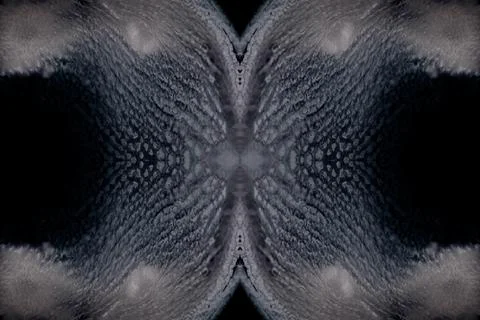 Mirrored grab of an evolving mixture of fluids - a closeup. Stock Photos