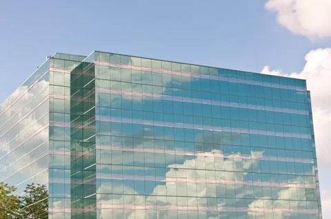 Mirrored Office Building Reflecting the Clouds Stock Photos