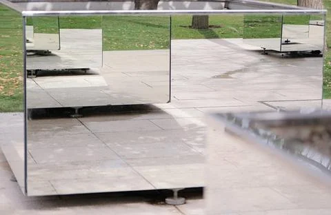 Mirrored rectangular flowered in modern stylish park making reflection effect Fotos de archivo
