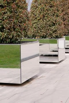 Mirrored rectangular flowered in modern stylish park making reflection effect Fotos de archivo