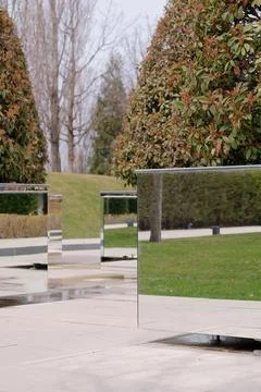 Mirrored rectangular flowered in modern stylish park making reflection effect Stock Photos