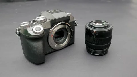 Mirrorless camera and it's lens Stock Photos