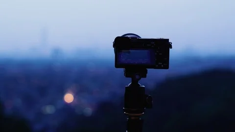 Mirrorless camera recording time lapse sequences during sunset Stock Footage 105721971
