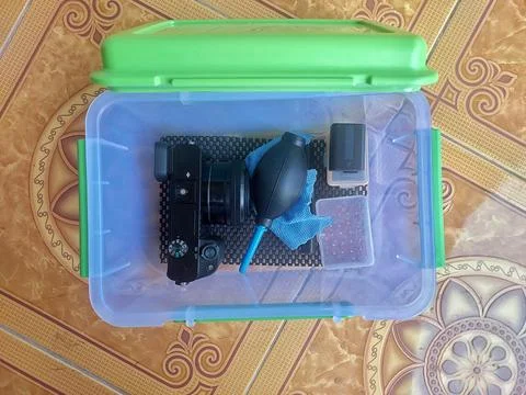 Mirrorless Camera Stored in a Dry Box for Protection Stock Photos