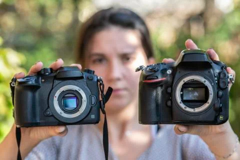 Mirrorless camera versus DSLR camera Stock Photos