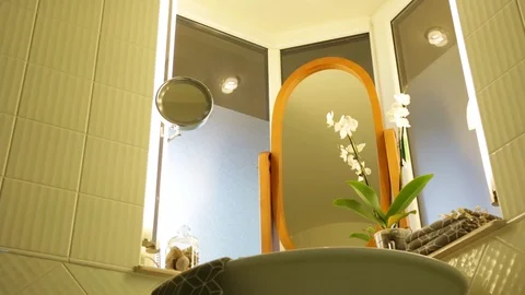 Mirrors With Orchids In The Bathroom Video stock 94347892