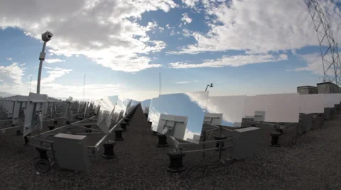 Mirrors reflecting blue sky and fluffy clouds at solar power plant Stock Footage 39353067