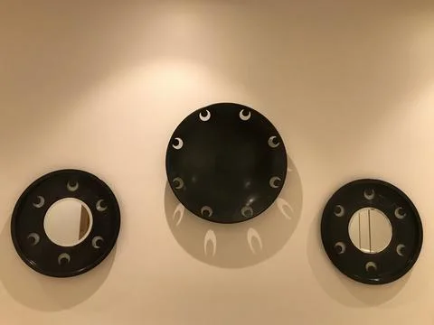Mirrors with scenery on the wall Stock Photos