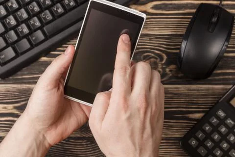 Miscellaneous office gadgets on wooden background Stock Photos