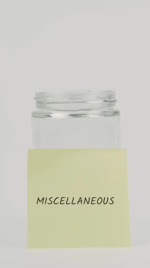 Miscellaneous text or word on yellow sticky note attached to glass jar Stock Footage 311755592