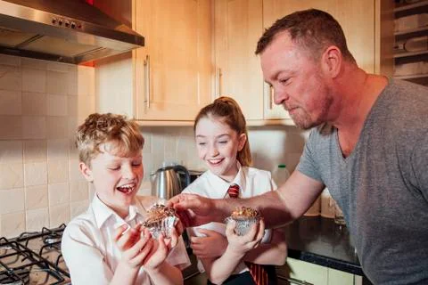 Mischevious Father Stealing some Cake Stock Photos