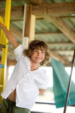Mischievous boy 10-11 years old on the playground. Stock Photos