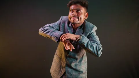 Mischievous guy acts silly as freeing Wrist Stock Footage 313669355